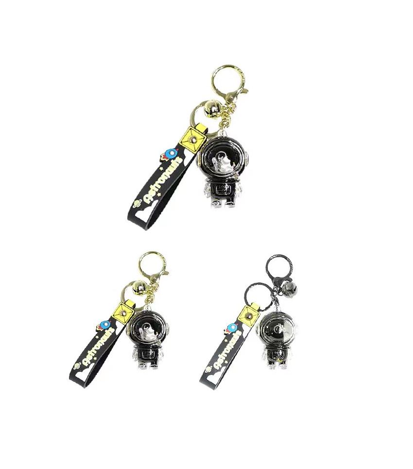 MINISO Astronauts Black & Gold Liquid Keychain